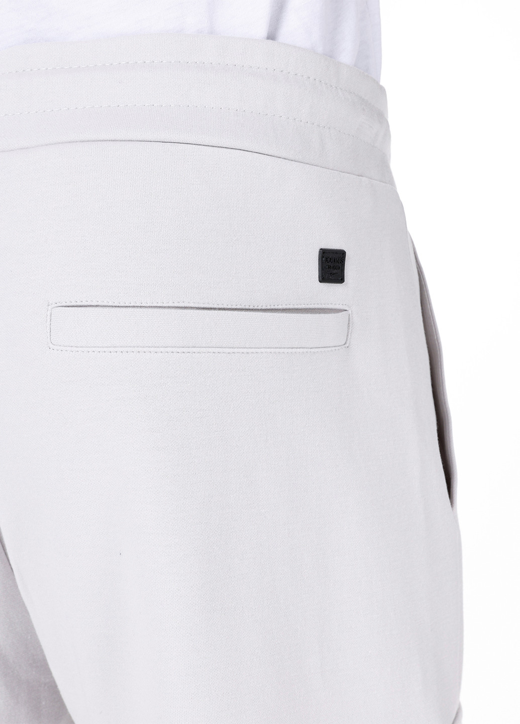 Белые спортивные демисезонные зауженные брюки Colin's