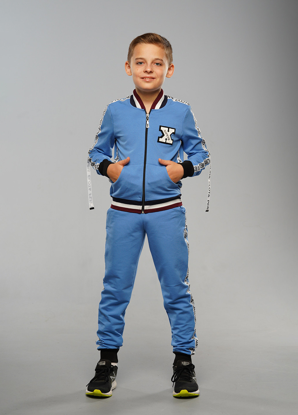 Голубой демисезонный спортивный костюм с надписями Sinthia (192445495)