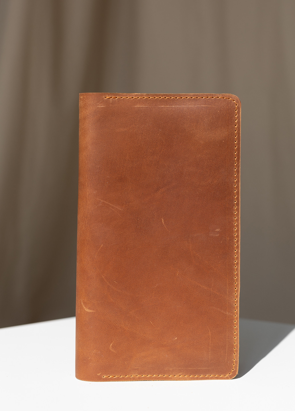 Практичное мужское портмоне на кнопке ручной работы из натуральной винтажной кожи коричневого цвета Boorbon (253513780)