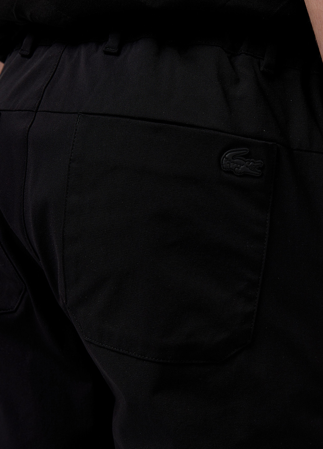 Черные кэжуал демисезонные зауженные брюки Lacoste