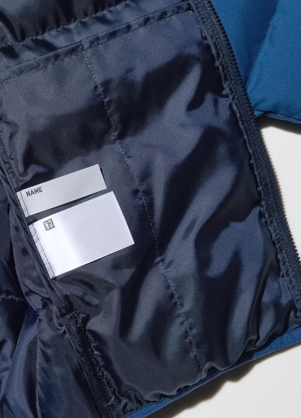 Синя зимня куртка Uniqlo