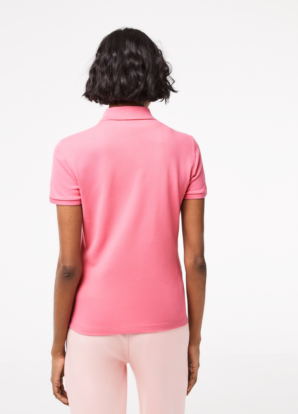 Розовая женская футболка-поло Lacoste однотонная