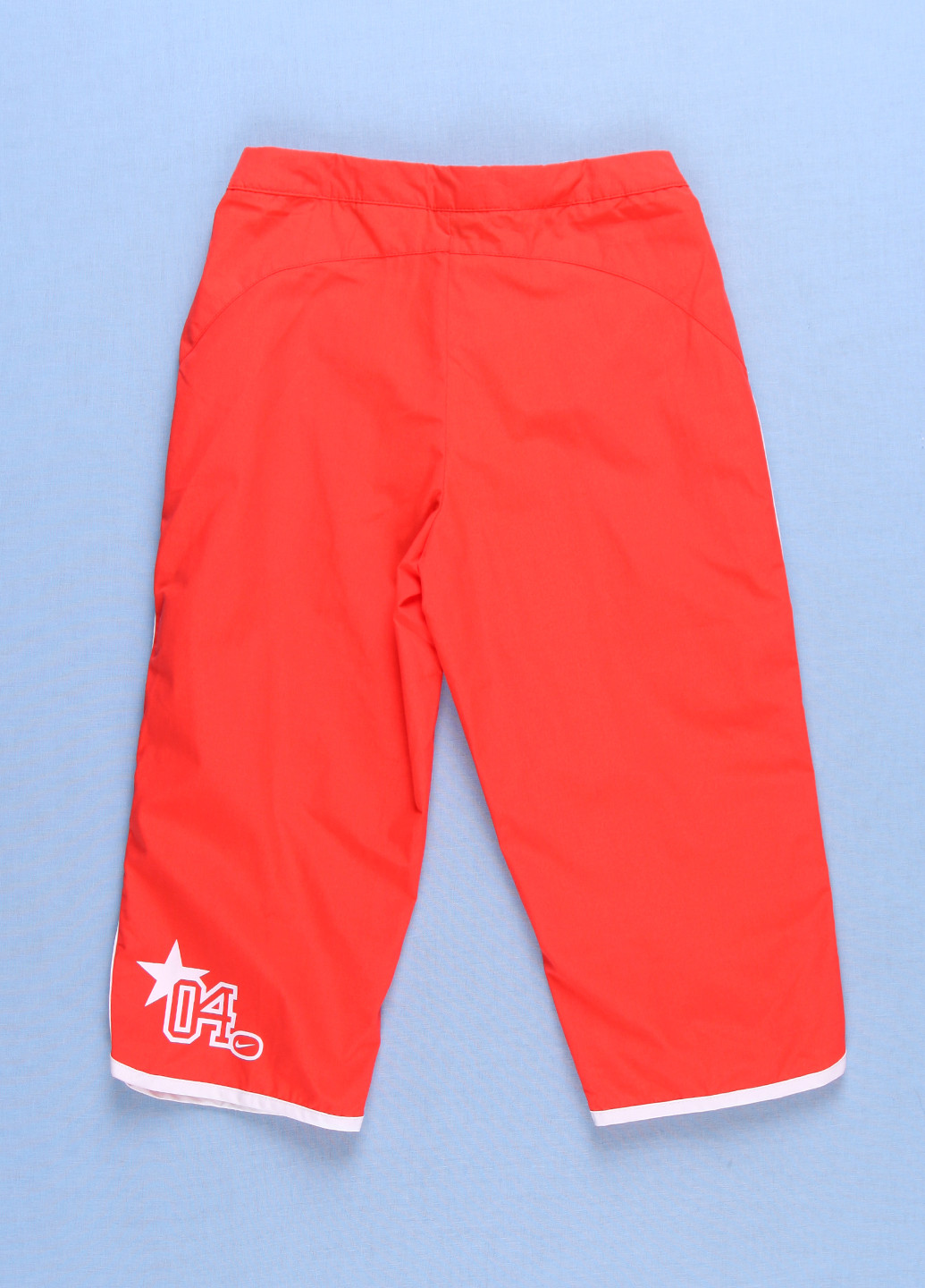 Оранжевые пляжный демисезонные брюки Nike