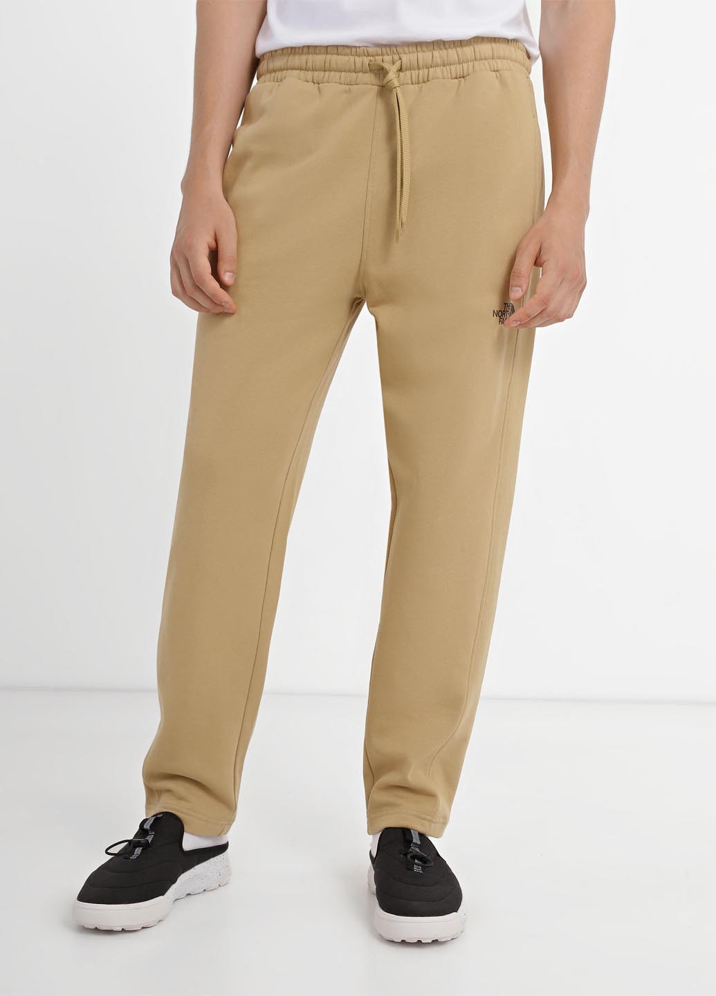 Бежевые спортивные демисезонные зауженные брюки The North Face