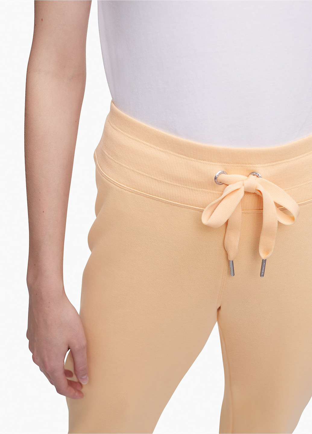 Светло-бежевые спортивные демисезонные зауженные брюки Calvin Klein