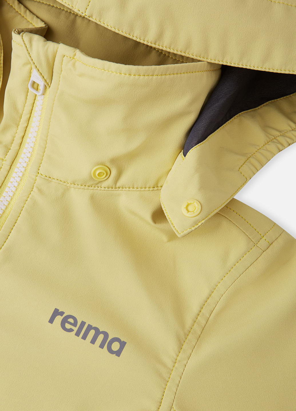 Жовта демісезонна куртка softshell Reima Kouvola