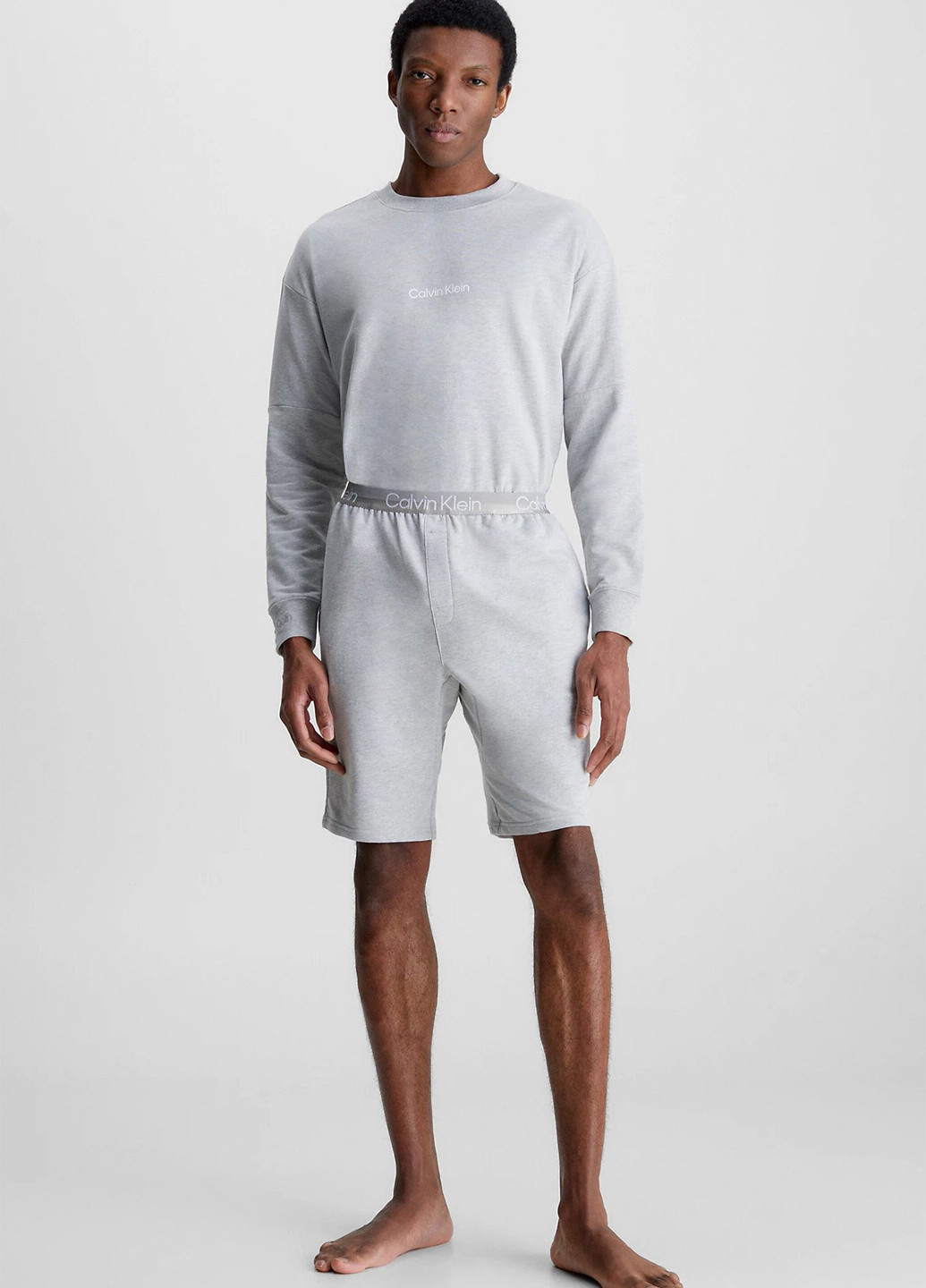 Серый свитшот Calvin Klein меланж без декора (328209639)