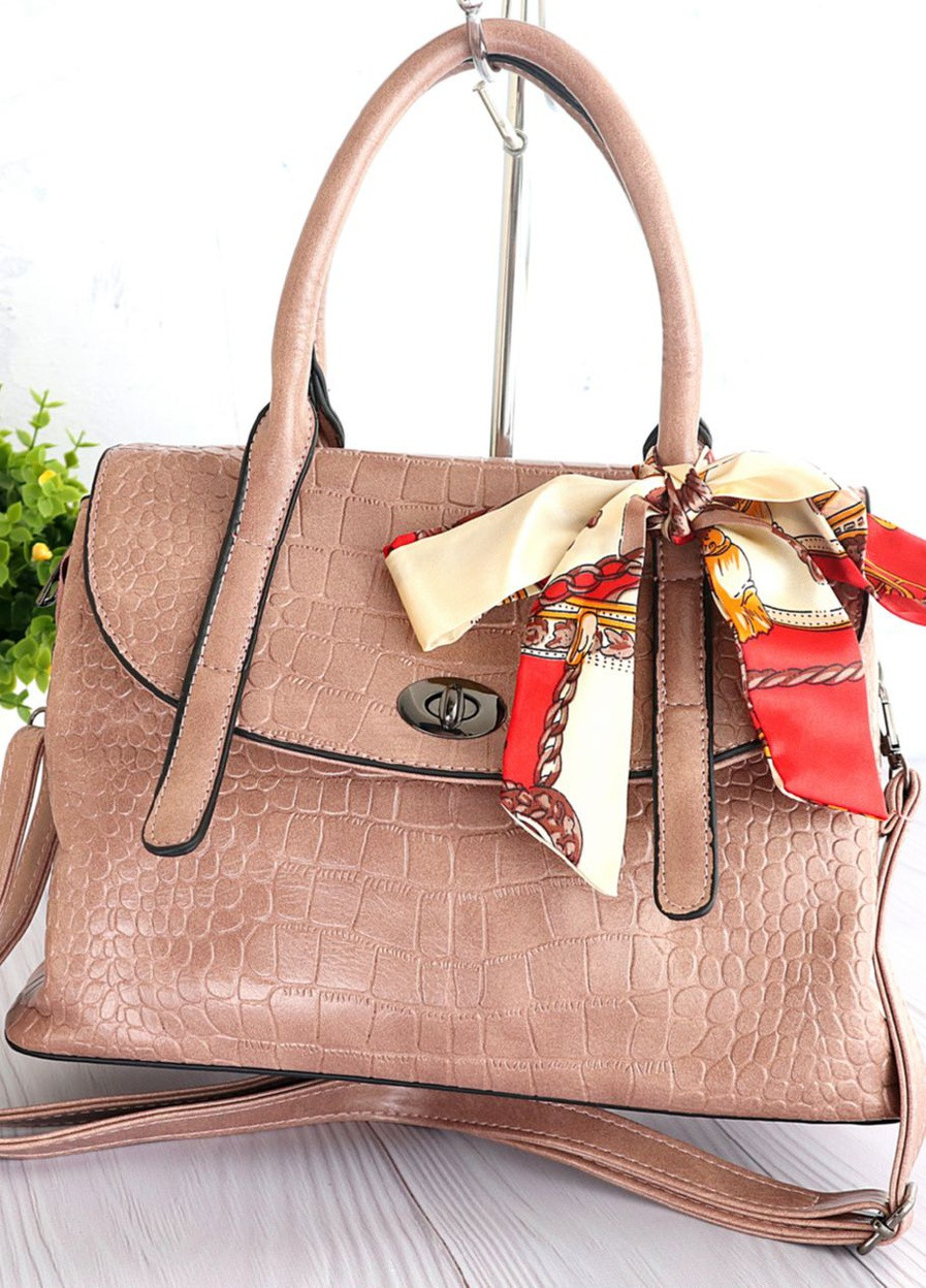 Красива жіноча сумочка з тисненням. Стильна жіноча сумка з бантиком Рожевий Daisy (204149704)