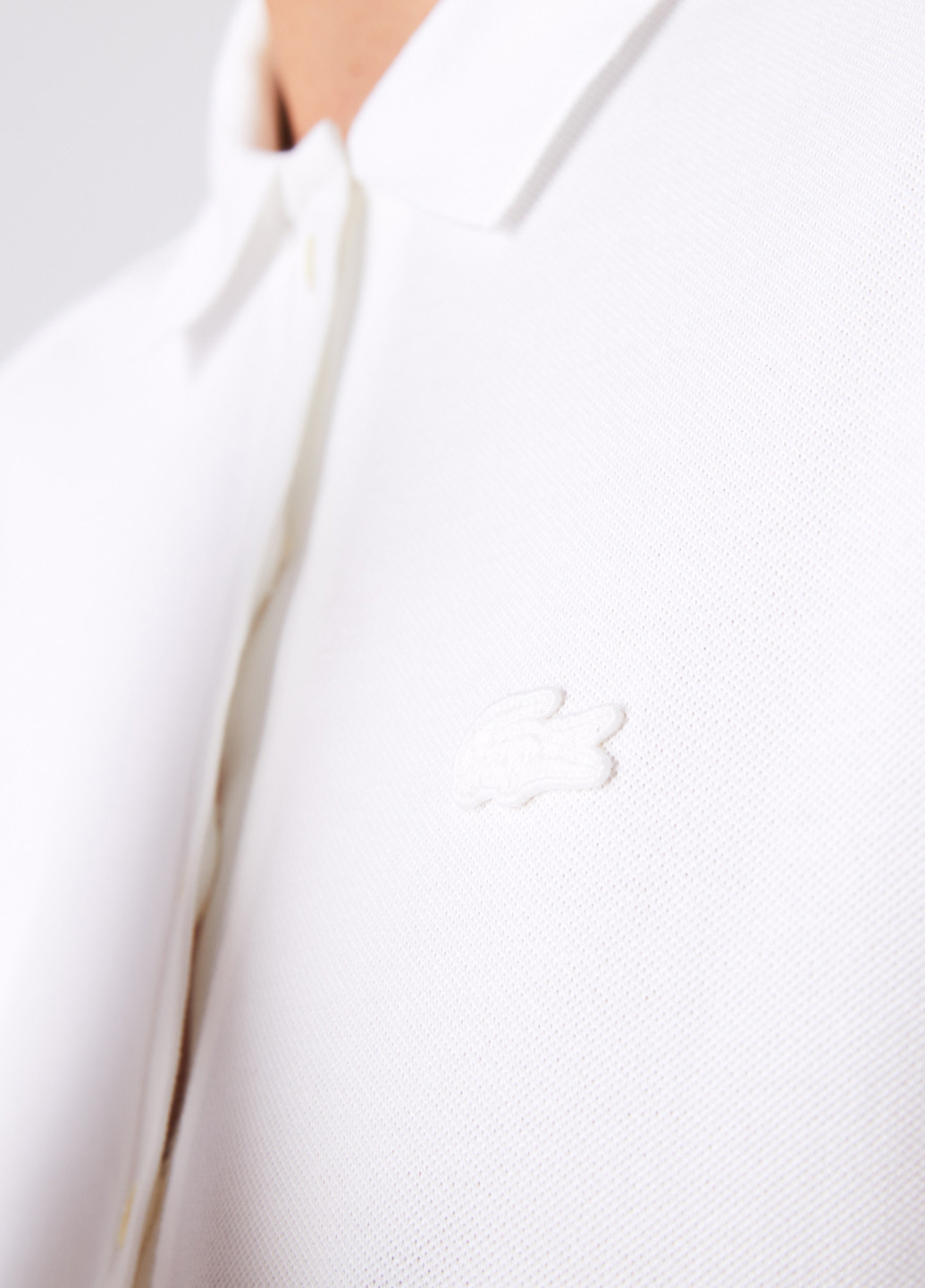 Белая женская футболка-поло Lacoste однотонная