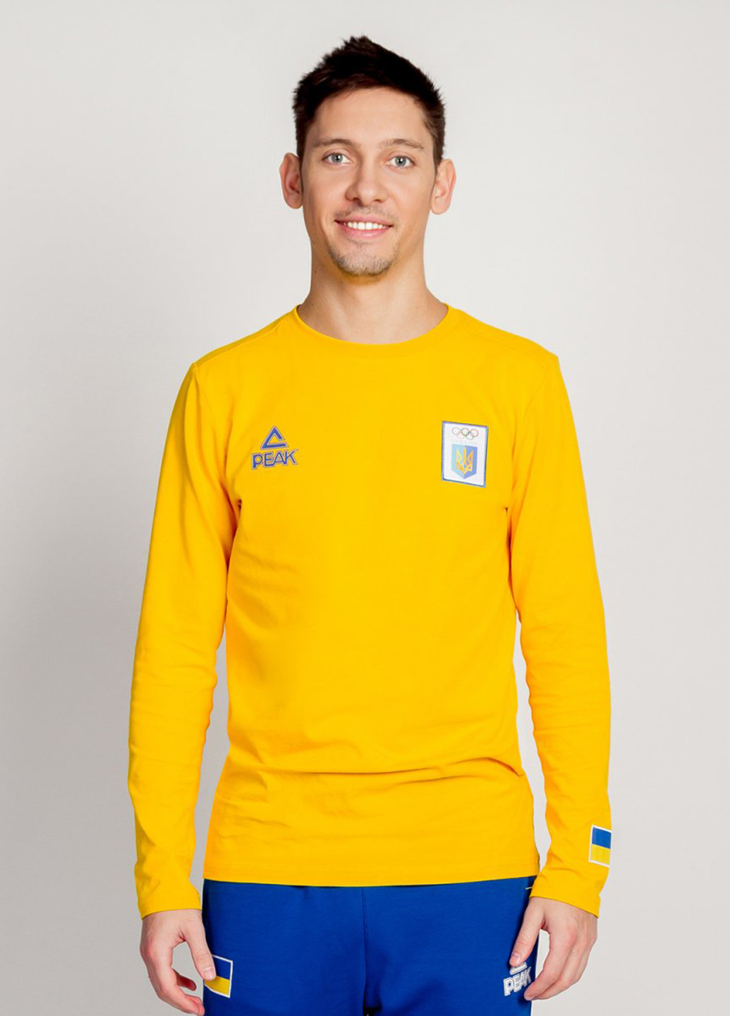 Желтый демисезонный спортивный лонгслив Peak с логотипом