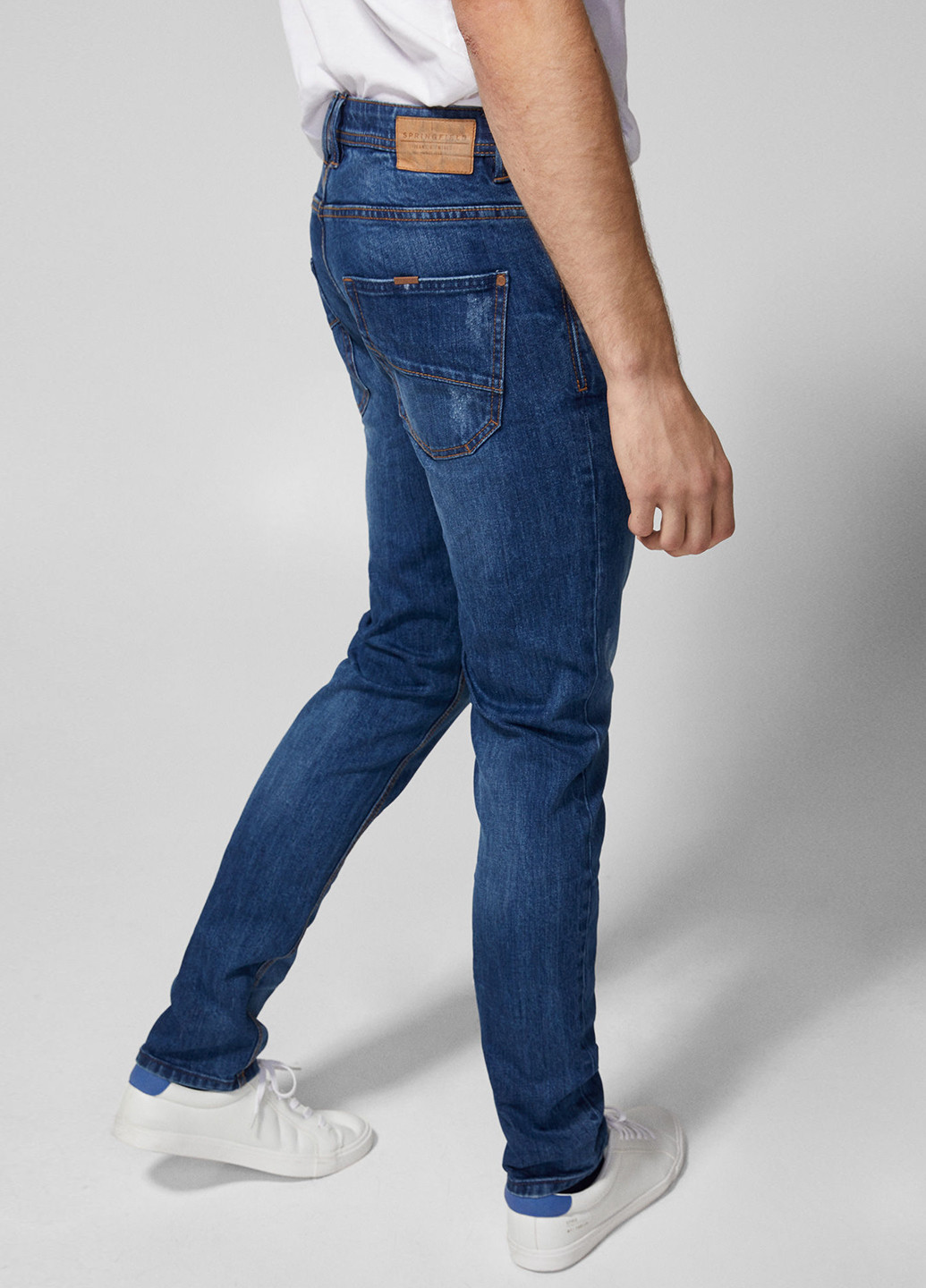 Синие демисезонные зауженные джинсы Springfield