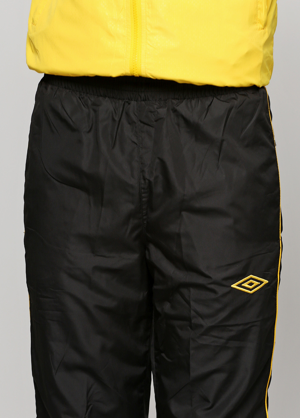 Жовтий демісезонний костюм (кофта, брюки) брючний Umbro