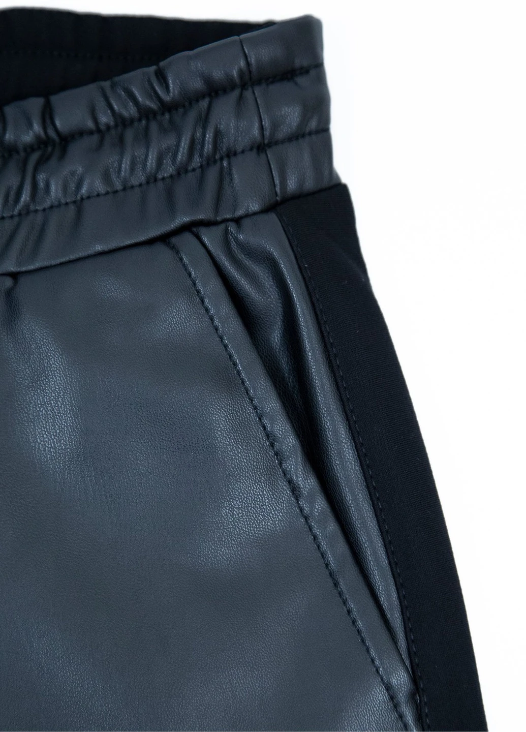 Штани жіночі шкірозамінник і трикотаж чорні Estensivo Slouchy (251839593)
