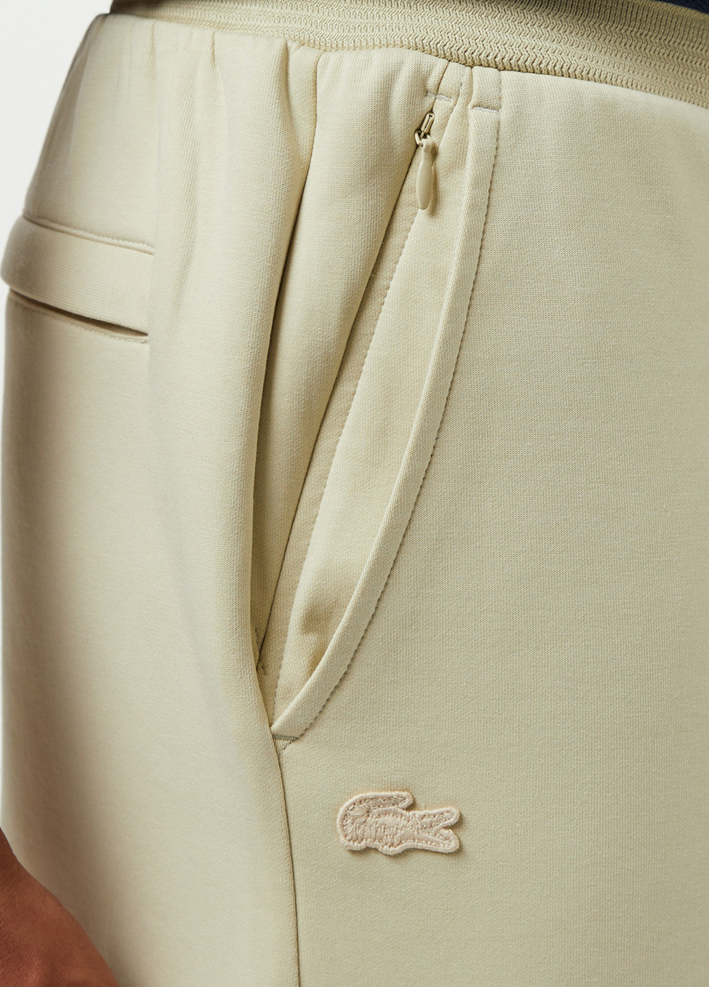 Бежевые спортивные демисезонные прямые брюки Lacoste