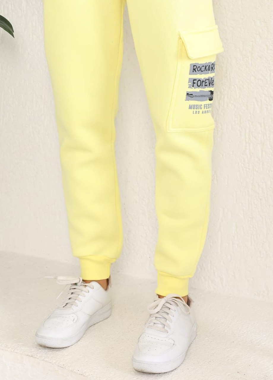 Спортивні жіночі штани на флісі жовті теплі MDG свободная (254091016)