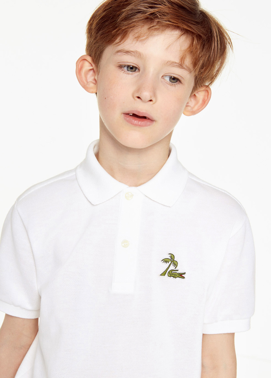 Белая детская футболка-поло для мальчика Lacoste однотонная