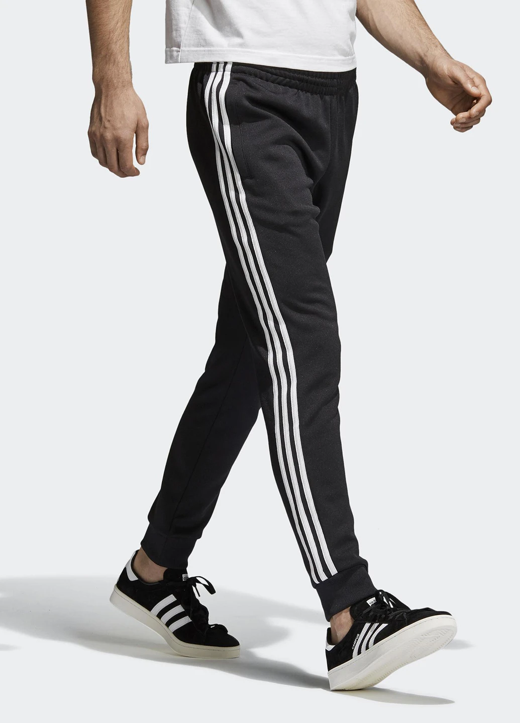 Черные спортивные демисезонные зауженные брюки adidas