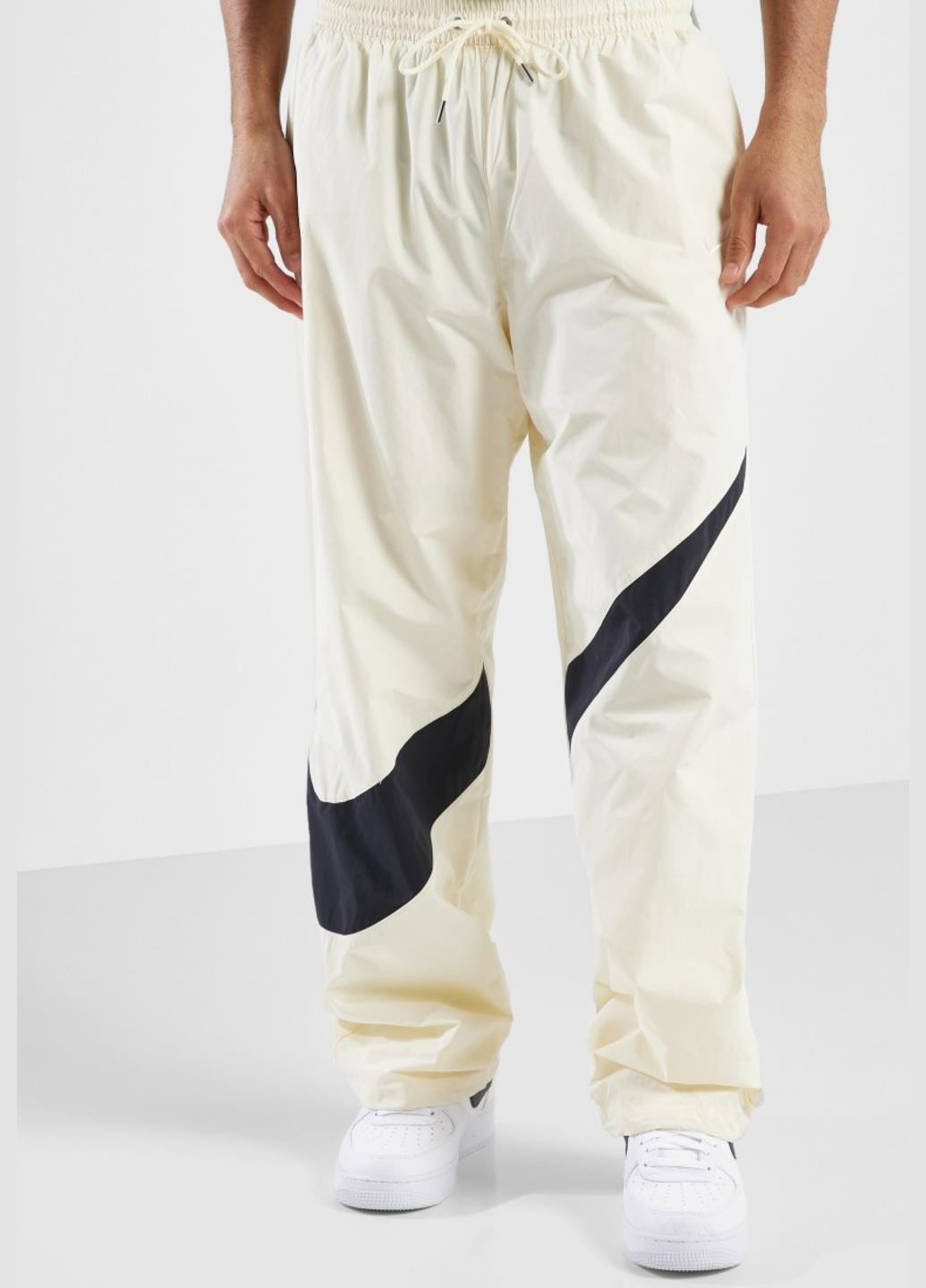 Бежевые спортивные демисезонные прямые брюки Nike