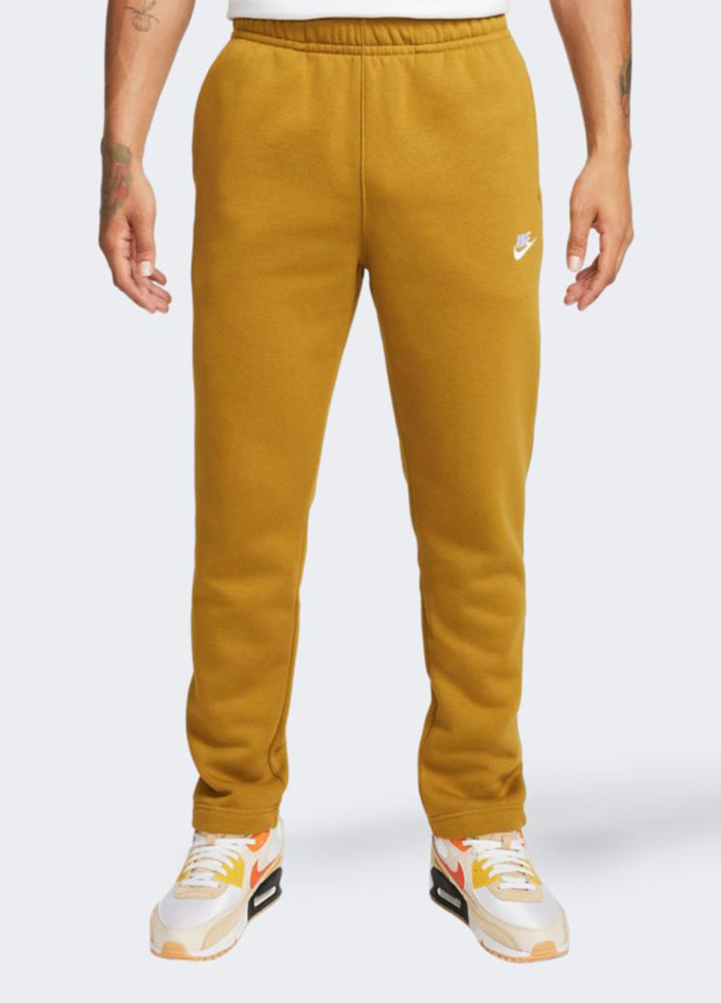 Горчичные спортивные демисезонные зауженные брюки Nike