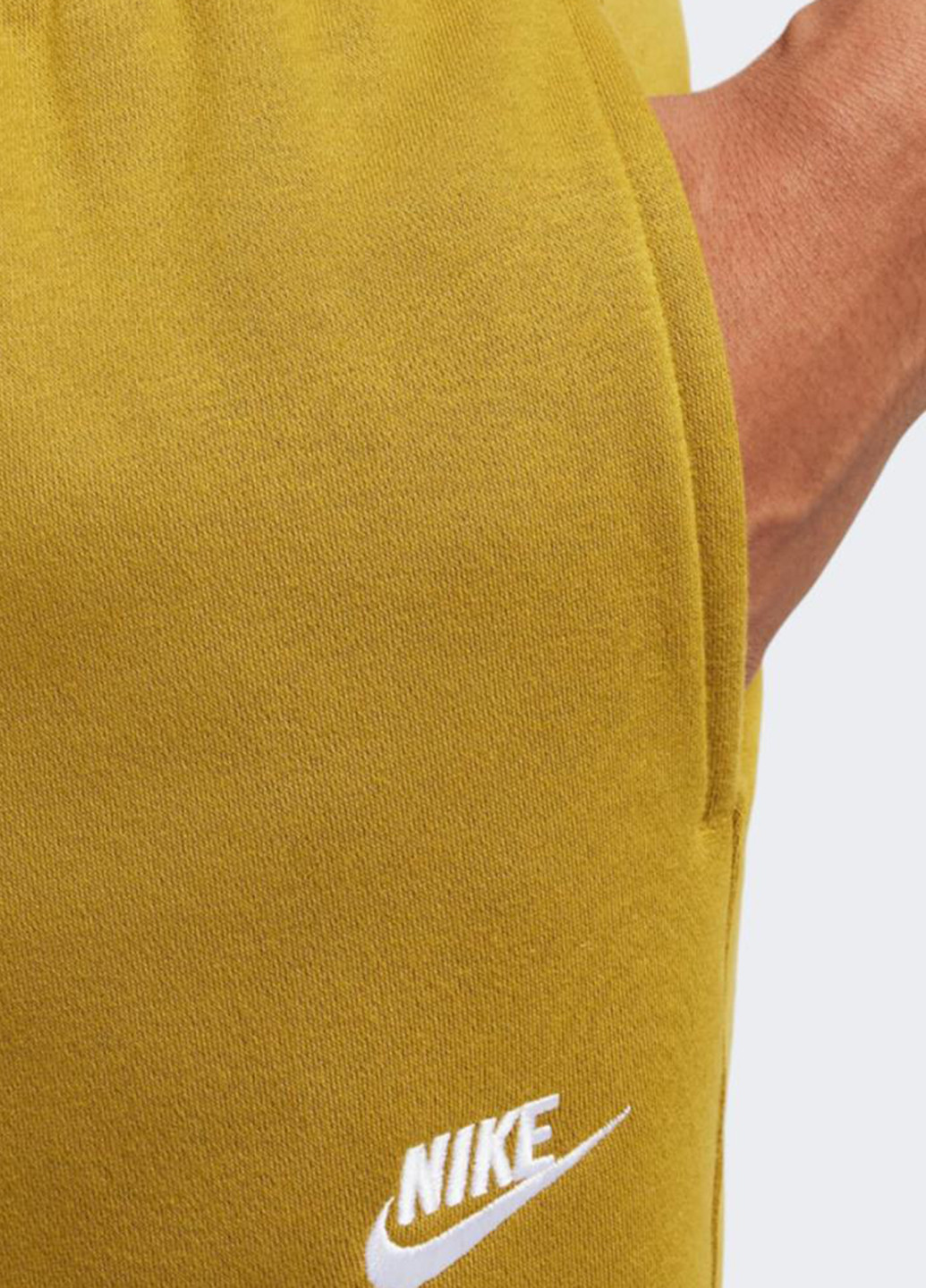 Горчичные спортивные демисезонные зауженные брюки Nike