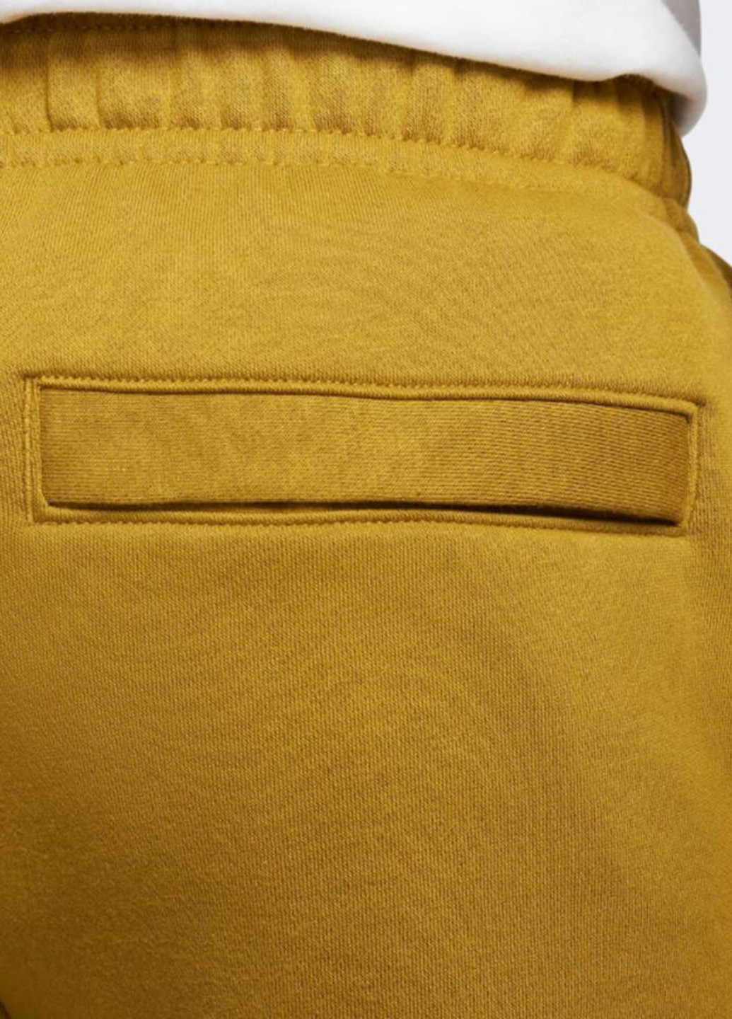 Горчичные спортивные демисезонные зауженные брюки Nike