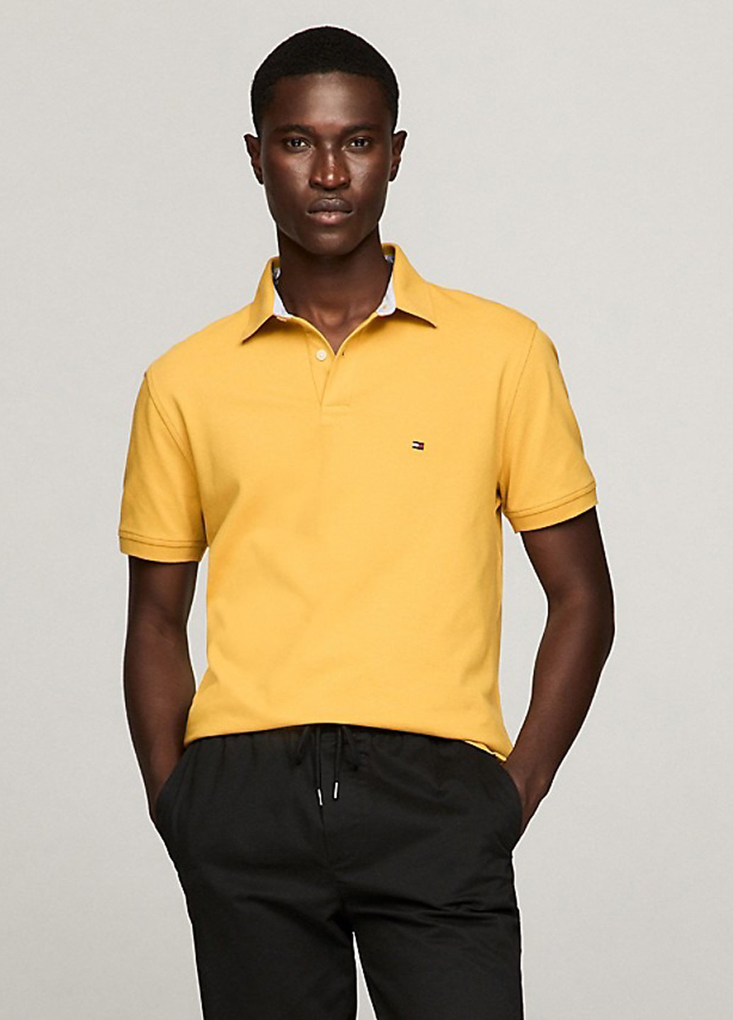 Желтая футболка-поло для мужчин Tommy Hilfiger однотонная