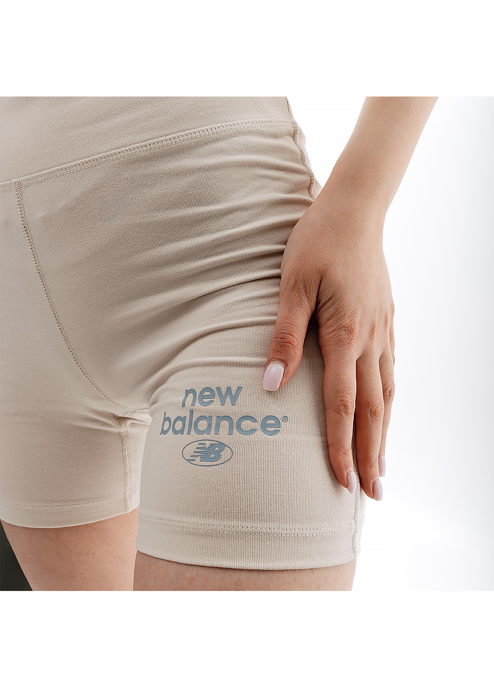 Жіночі Шорти Essentials Reimagined Arch. Бежевий New Balance (260946264)