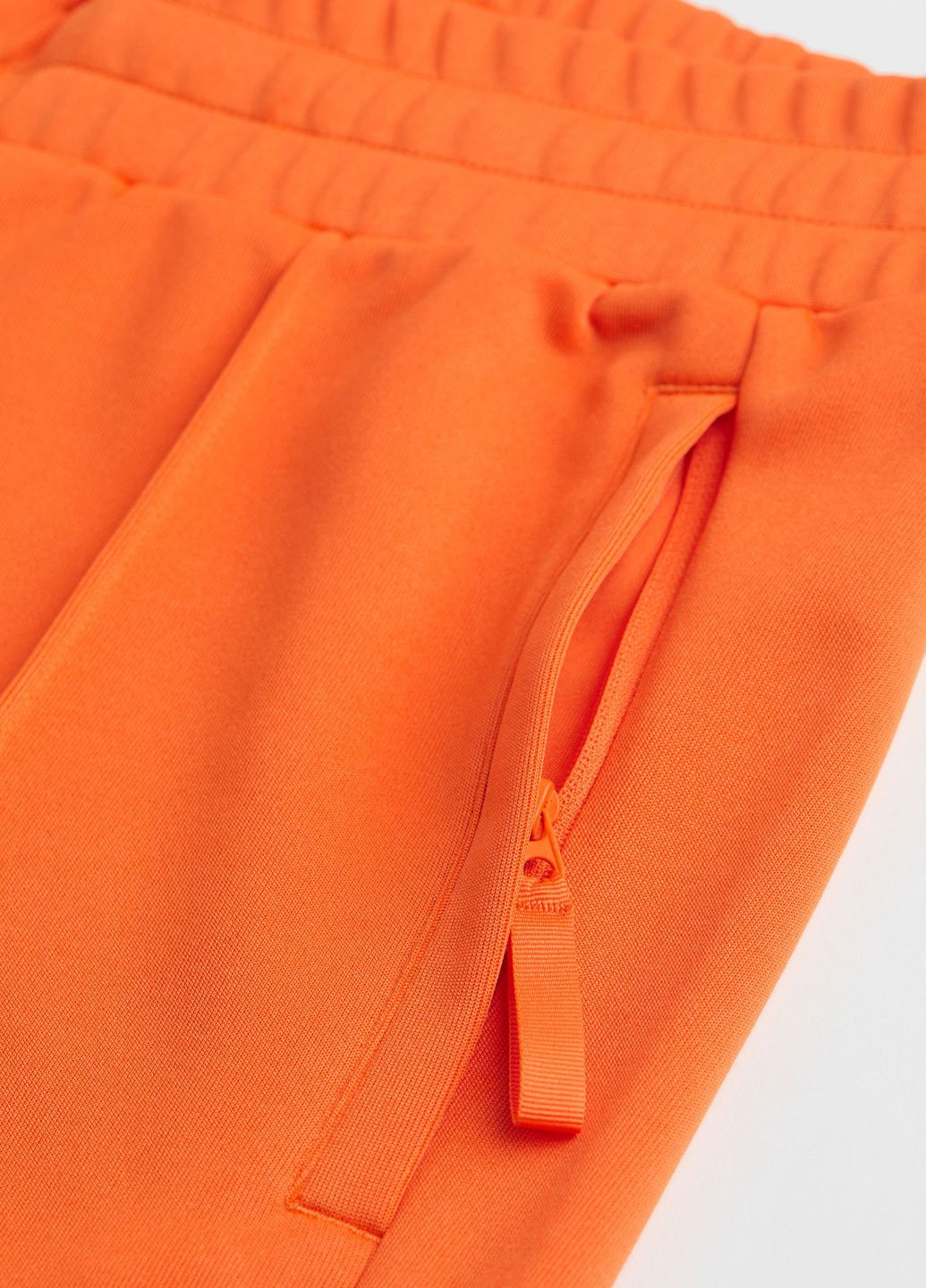 Оранжевые спортивные демисезонные брюки H&M SPORT