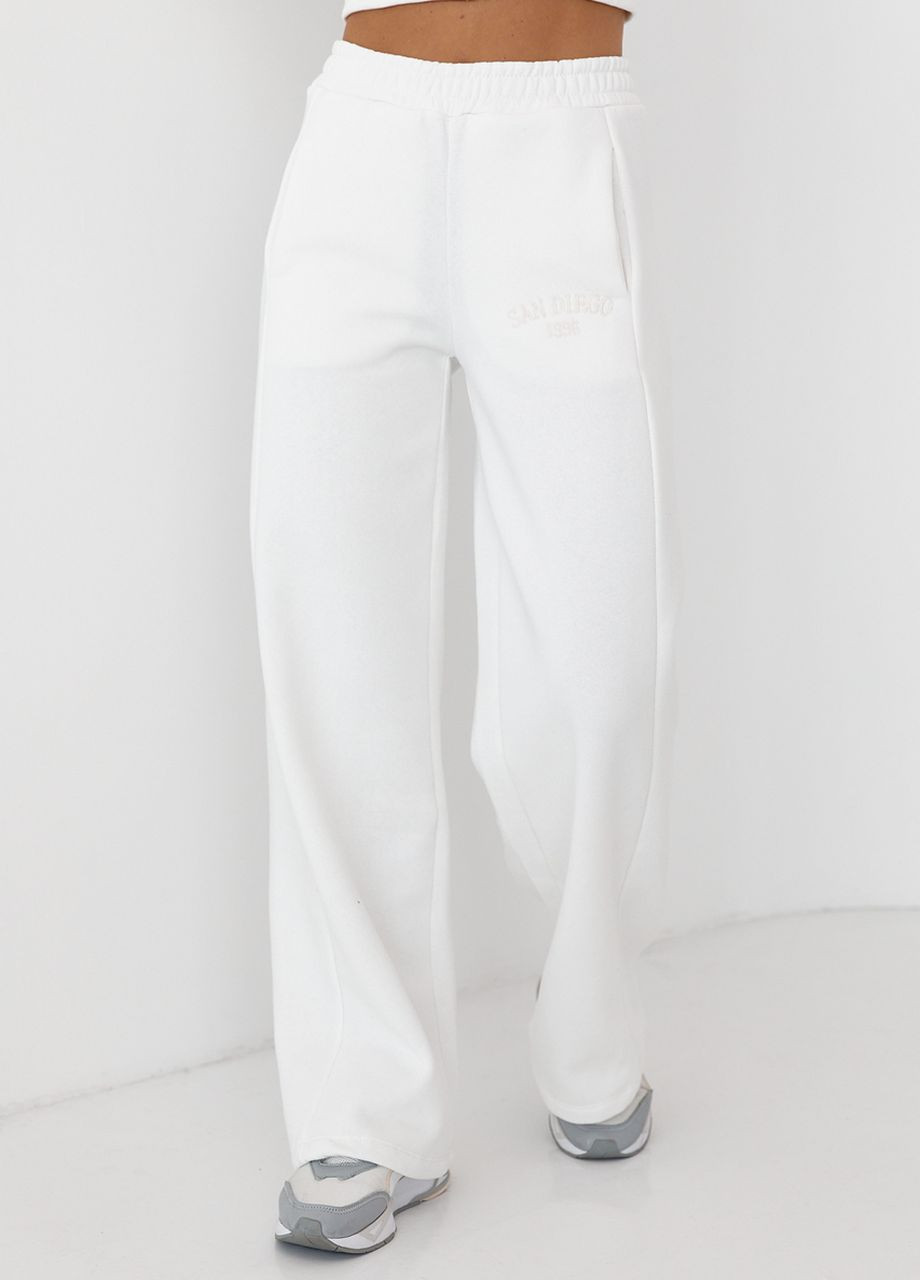 Утеплені трикотажні штани з кишенями Lurex (266994001)