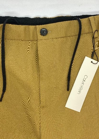 Горчичные кэжуал демисезонные зауженные брюки Calvin Klein