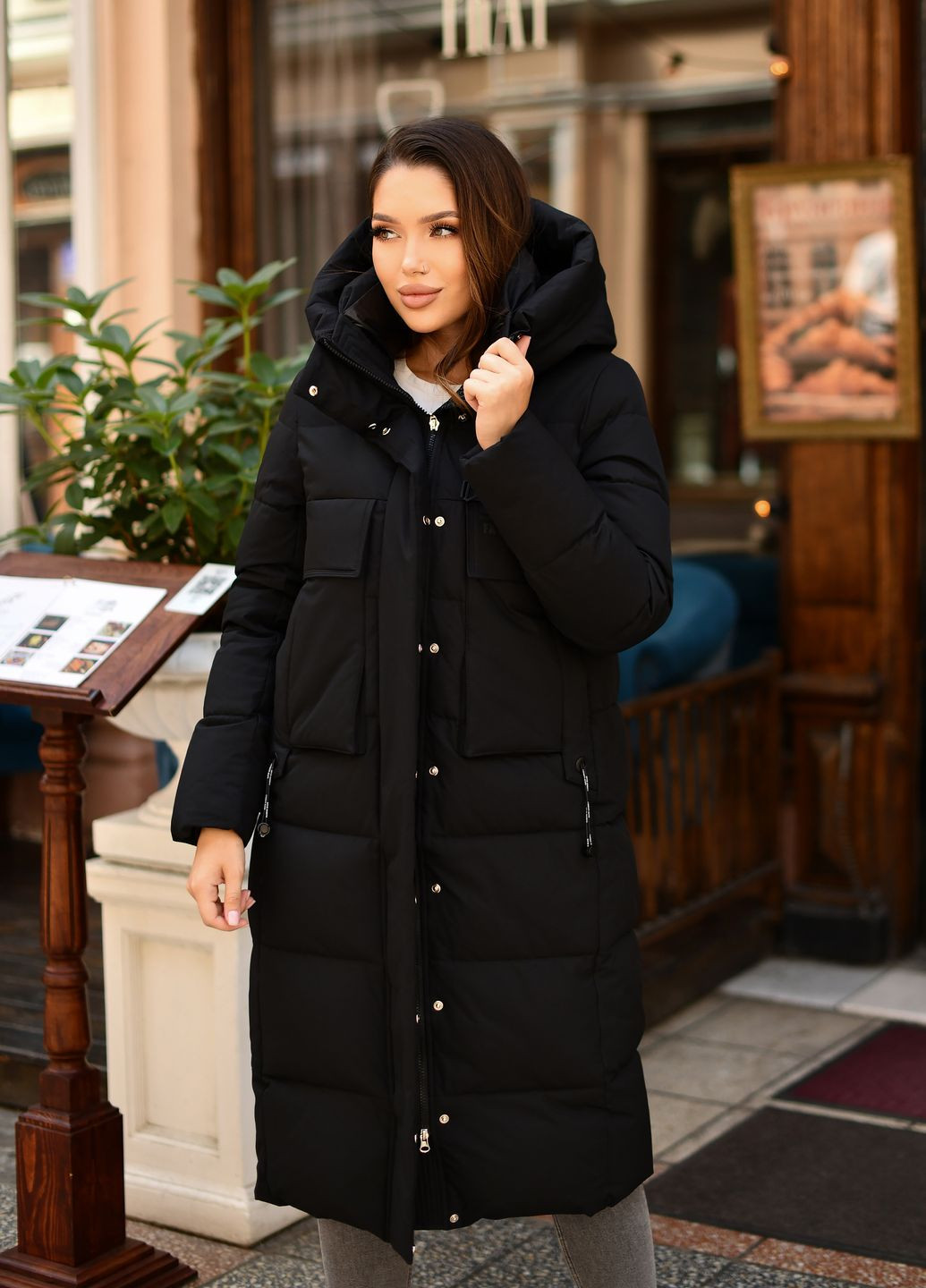 Черная зимняя женское длинное зимнее пальто черное 77142 Hadavoee