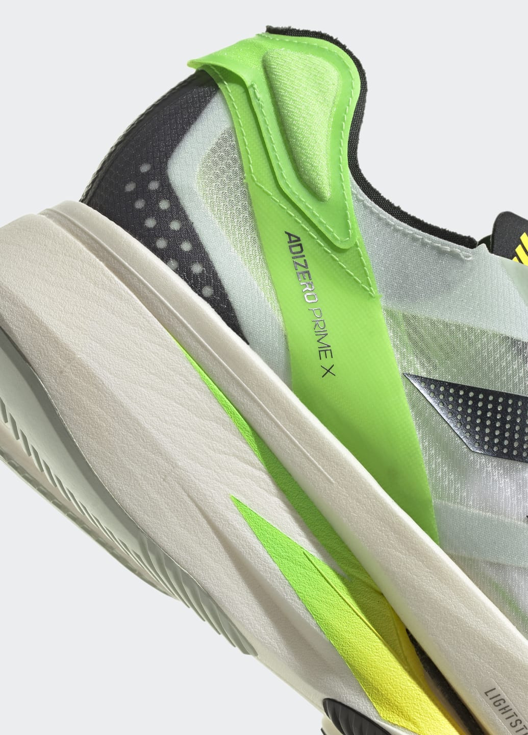 Зелені всесезонні кросівки для бігу adizero prime x adidas