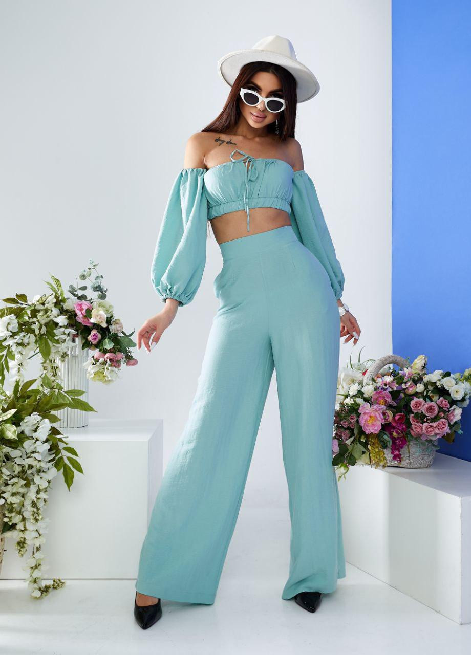 Жіночий костюм топ і штани палаццо оливкового кольору 387262 New Trend (258685888)