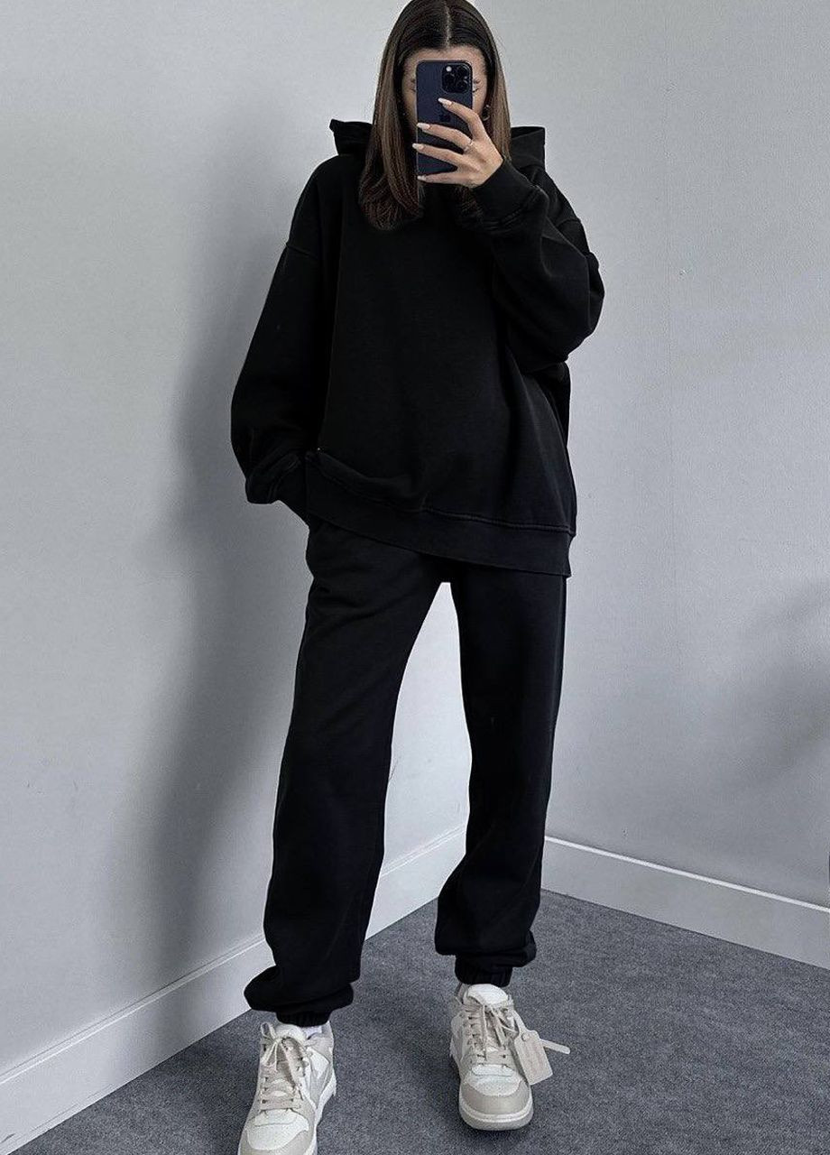 Жіночий спортивний костюм на флісі чорного кольору Let's Shop (277151632)