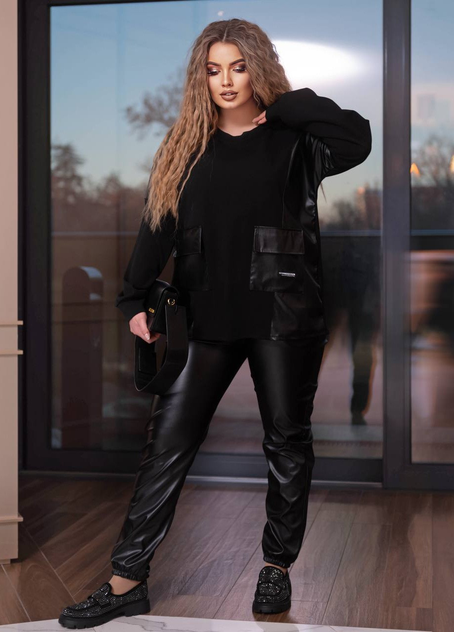 Жіночий костюм двійка лосини з еко шкіри кофта креп дайвінг чорного кольору 405444 New Trend (258646570)