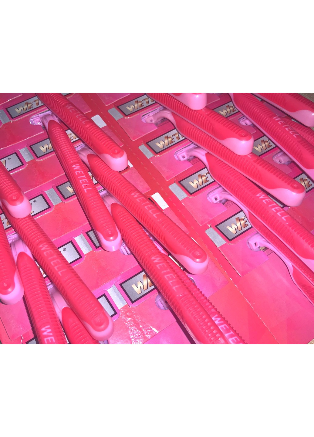 Станки для гоління одноразові пластмасові рожеві WETELL Profissional 24шт/11см FROM FACTORY (260744032)