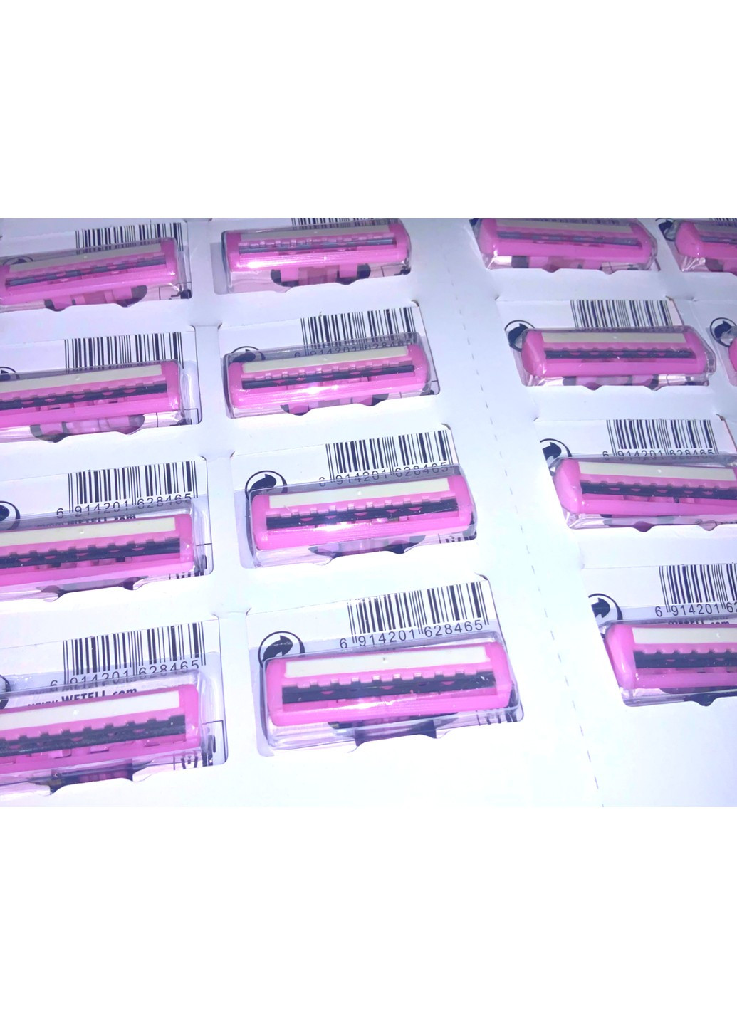 Станки для гоління одноразові пластмасові рожеві WETELL Profissional 24шт/11см FROM FACTORY (260744032)