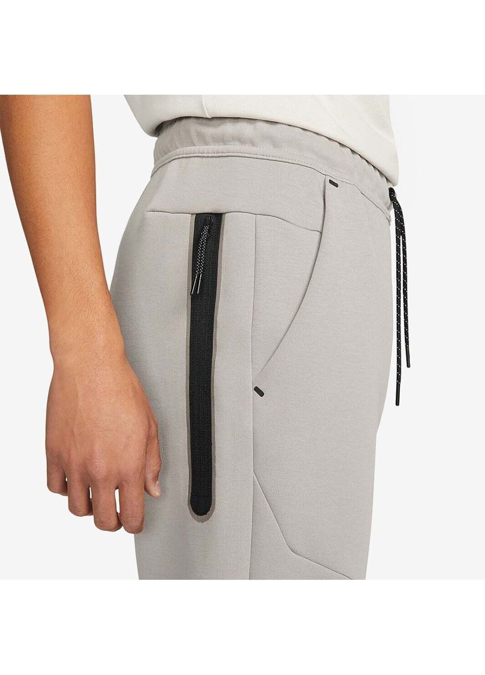 Серые демисезонные брюки Nike