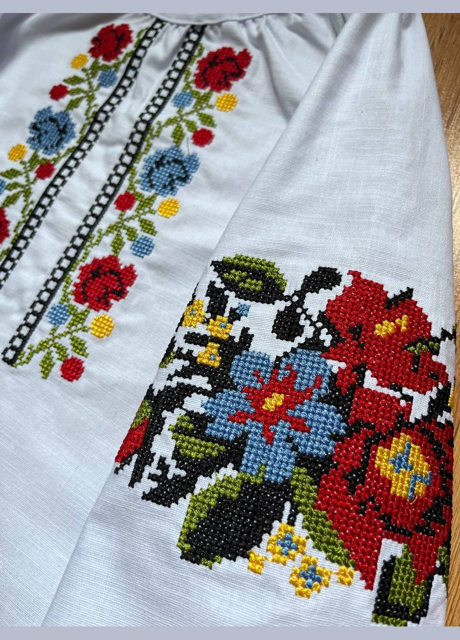 Біла стильна дитяча вишиванка «барви україни» з квітковим орнаментом, рукав 3/4 візерунок квітковий еластан, льон (333616104)