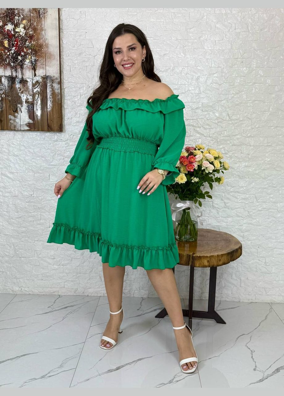 Зеленое платье любопытного кроя Україна однотонное
