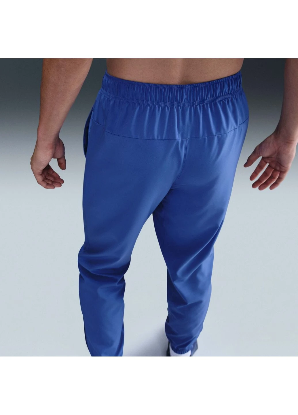 Синие демисезонные брюки Nike