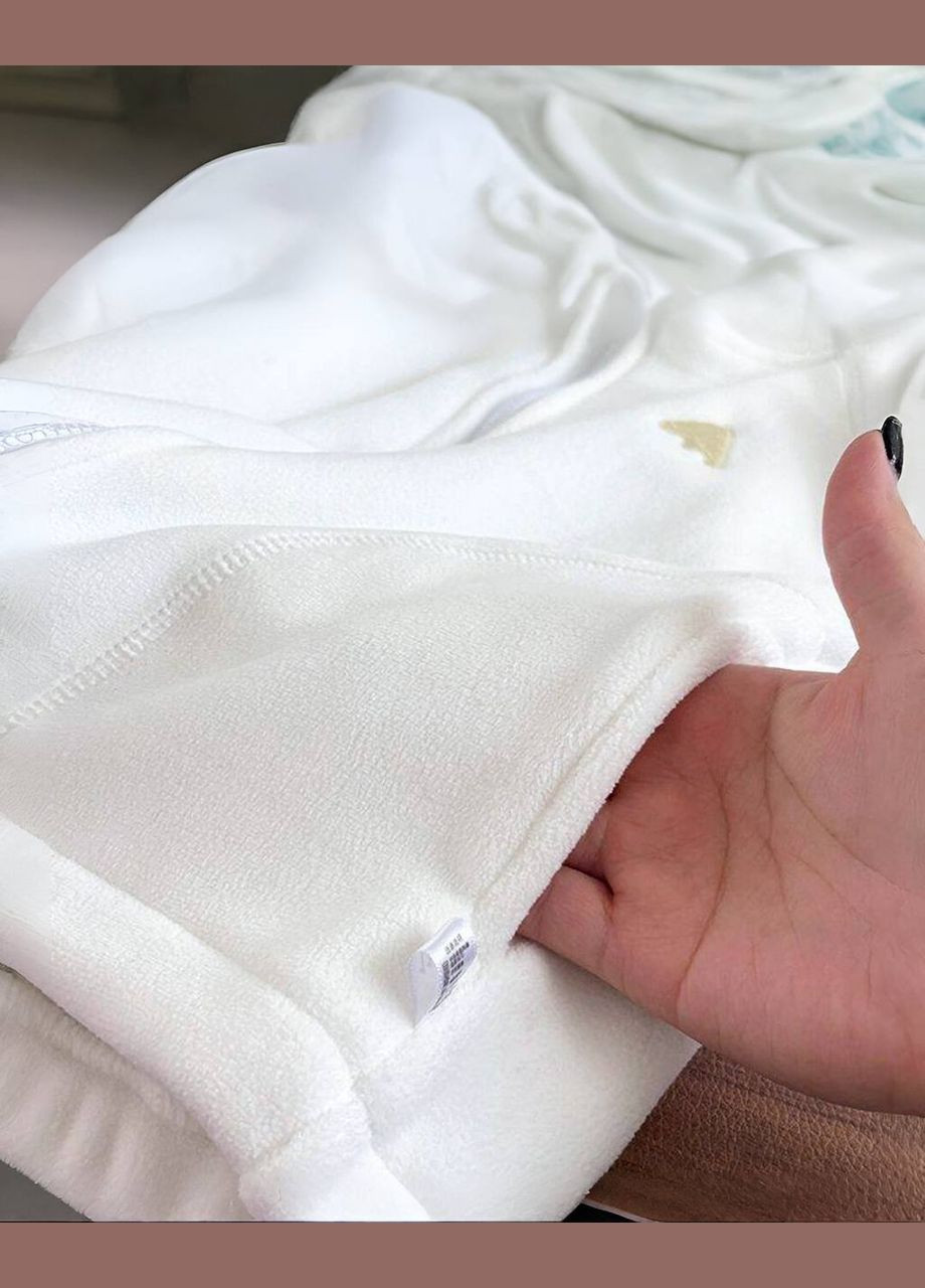 Білий демісезонний костюм дитячий з вишивкою брючний Garna