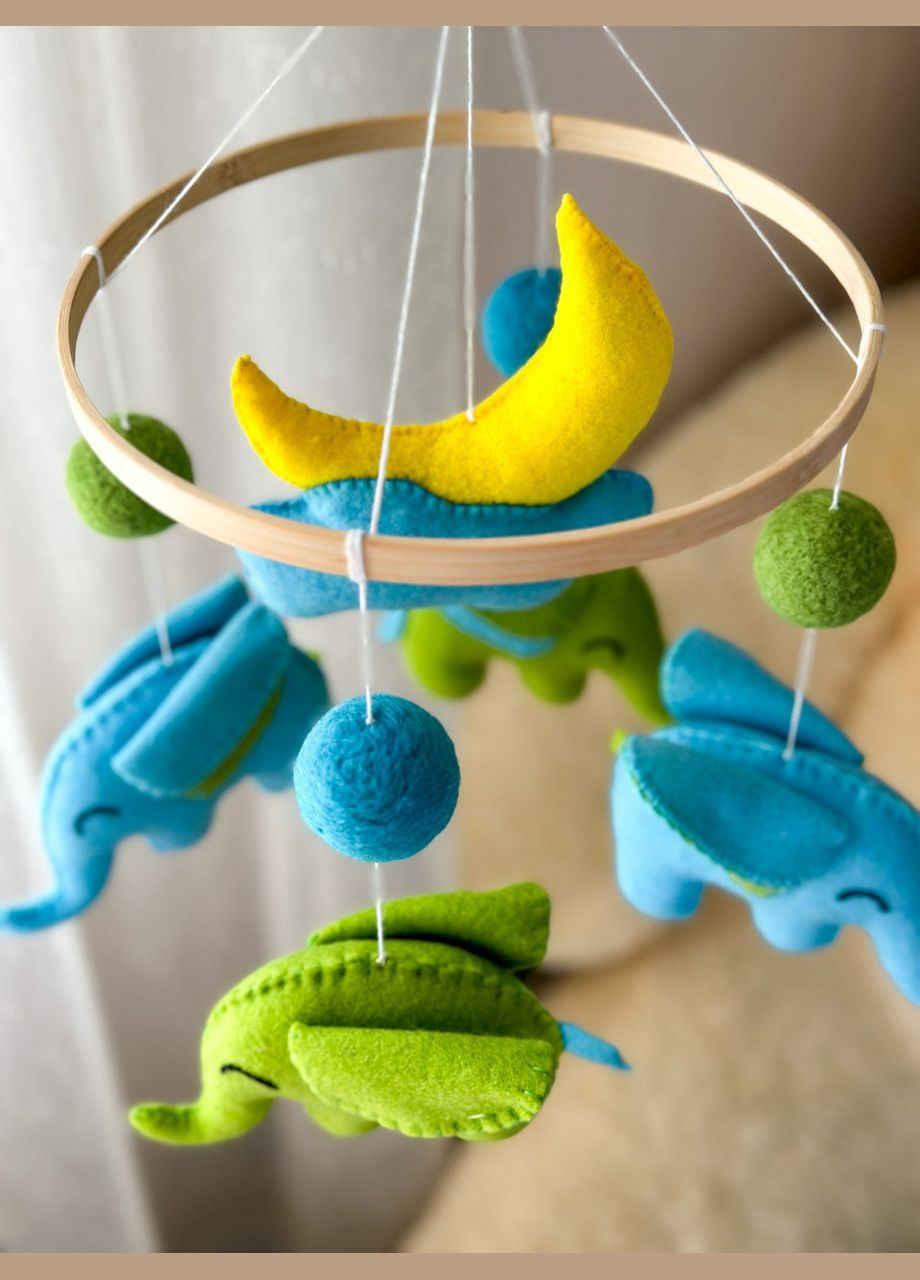 Дитячий музичний мобіль на ліжечко для немовлят WooolyWool «Слоненята» з 35 мелодіями No Brand (342757890)