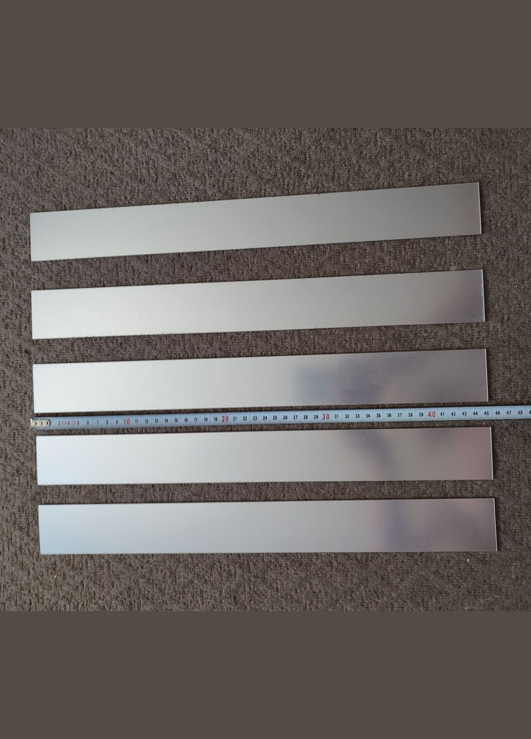 Дзеркальні наклейки смужки пластикові 45 х 5 см срібло 5 шт No Brand (317353467)