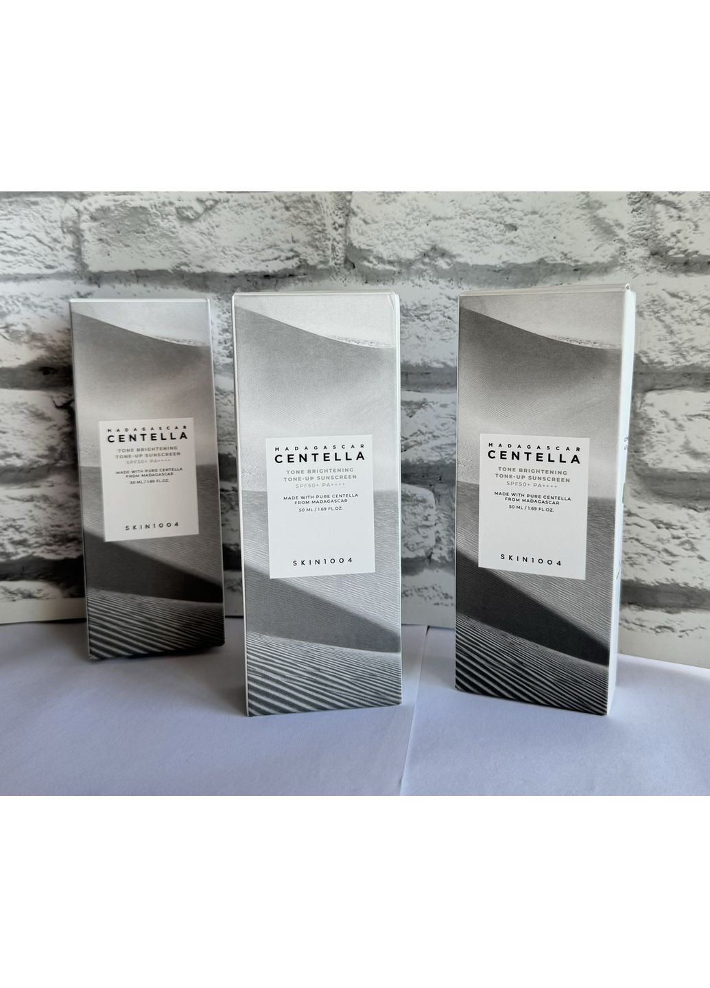 Сонцезахисний крем для вирівнювання тону Мadagascar Centella Tone Brightening Tone-up Sunscreen SPF50+ PA+++ SKIN1004 (369569511)