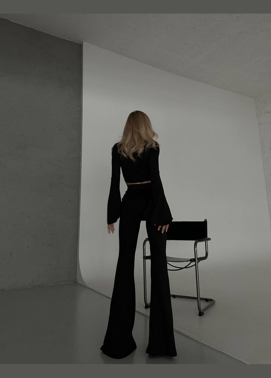 Жіночий костюм топ і штани клеш колір чорний р.46/48 452382 New Trend (285711589)