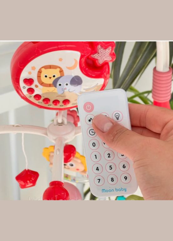 Музыкальный проектор мобиль-ночник 698-84-85 карусель с подвесными элементами Розовая с пультом Kimi (327217308)