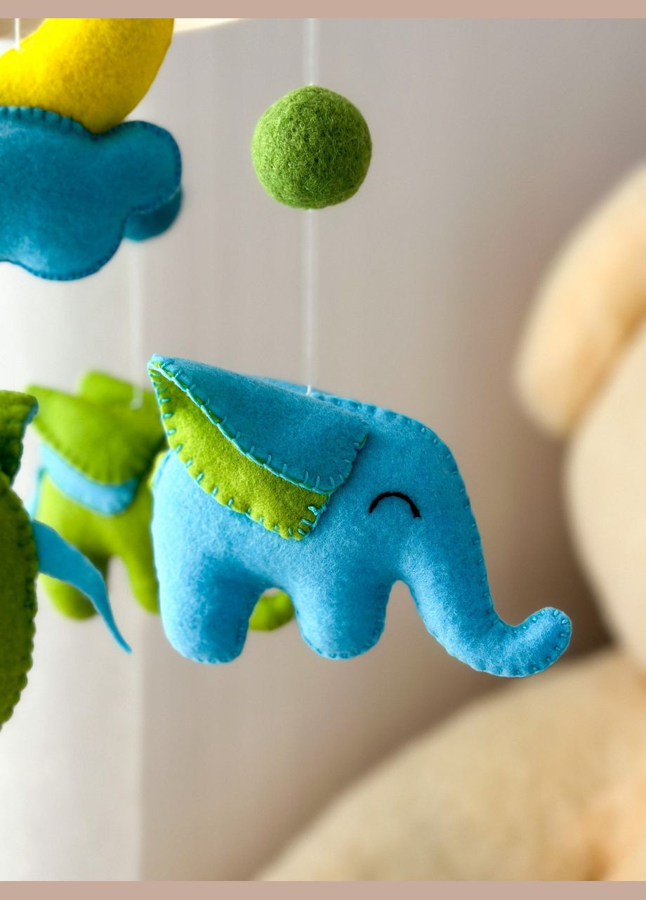 Дитячий музичний мобіль на ліжечко для немовлят WooolyWool «Слоненята» з 35 мелодіями No Brand (342757890)