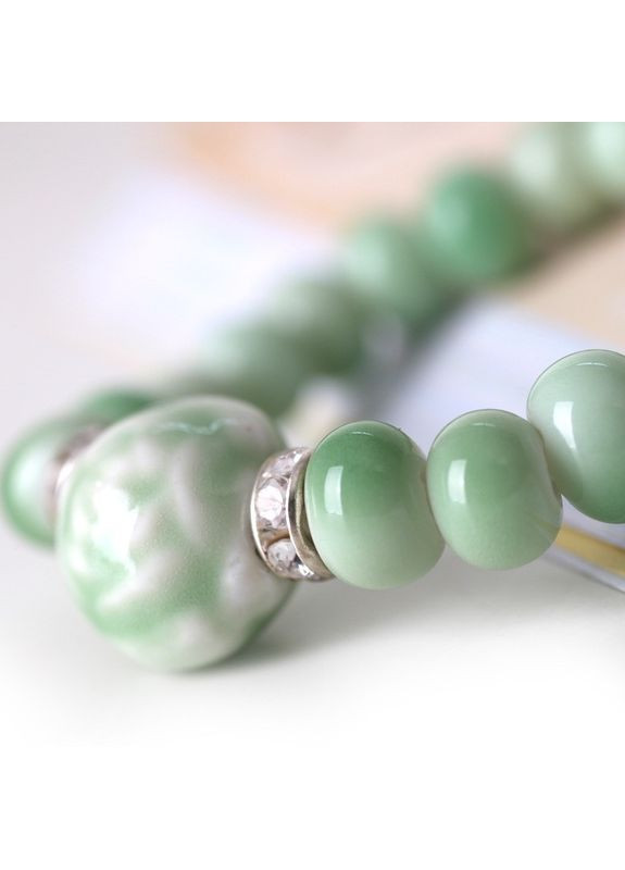 Модний жіночий браслет з керамічними намистинами «Cat eye» (зелений) China (367623242)