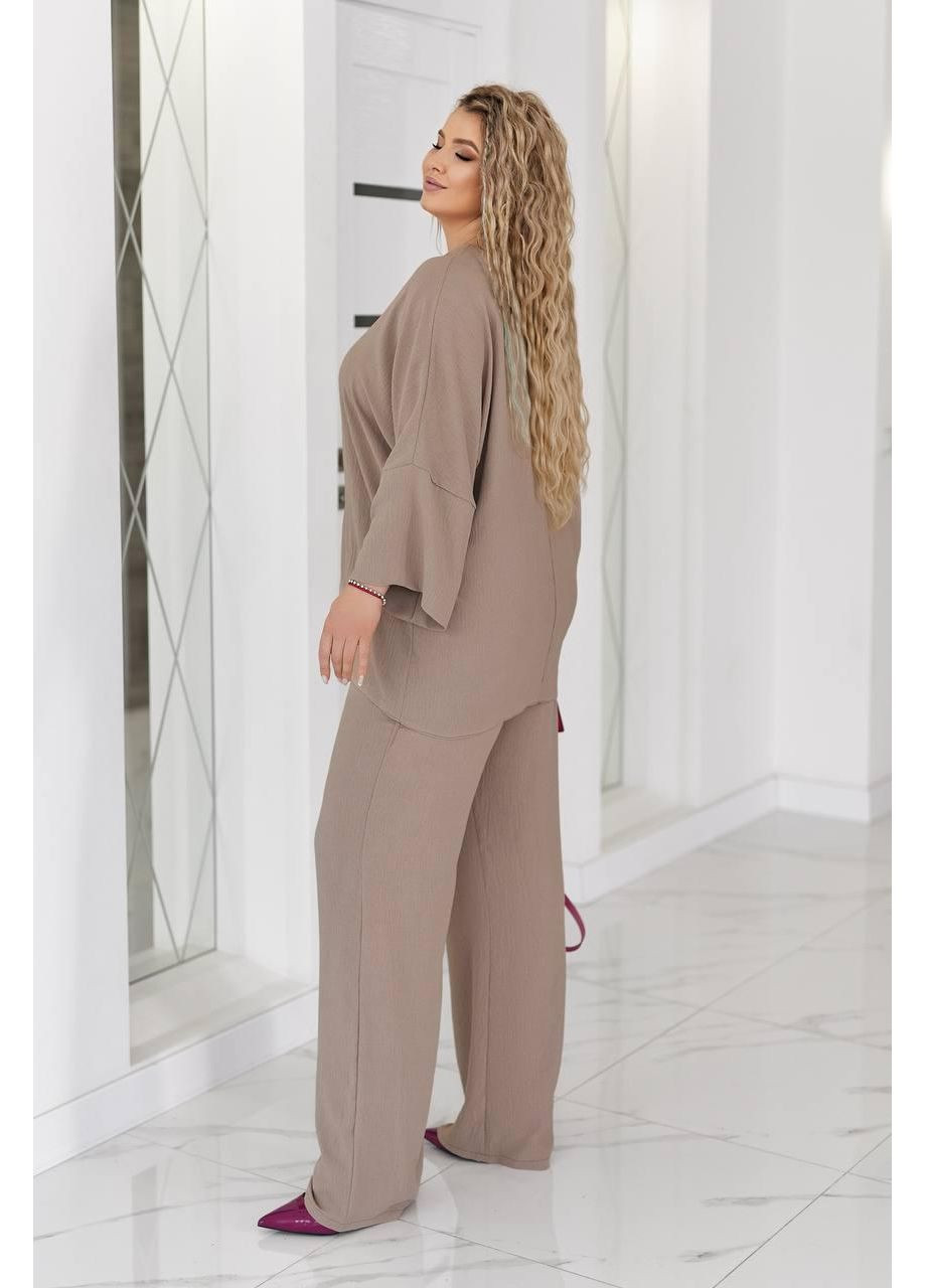 Жіночий костюм оверсайз із текстурної тканини, розмір 58-60 із вільними штанами та блузкою No Brand (366221614)